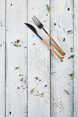 Wood Fork and Knife with Green Herbs