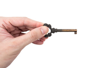 Male hand holding metal key on white background