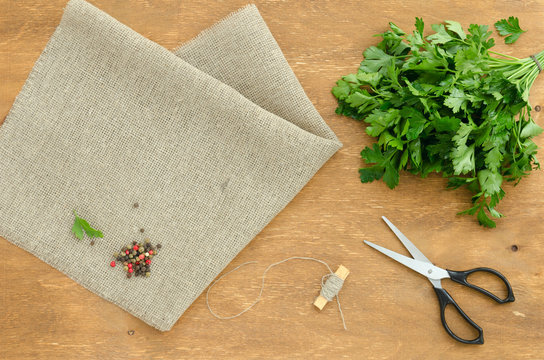 Bunch of parsley is on linen napkin