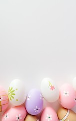 Fototapeta na wymiar Colorful Easter eggs on white background with space for message