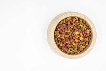 Dog food in a bowl on white background.