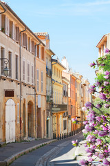 old town street of Aix en Provence at spring day, France