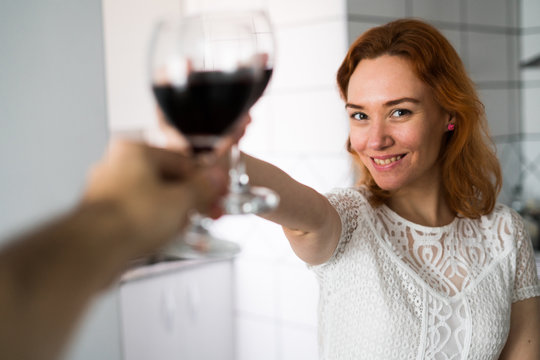 Woman clanging glasses