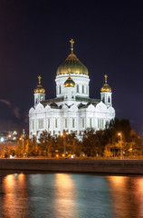 Fototapeta na wymiar The Christ the Savior Cathedral at night view from the river. Russia, Moscow