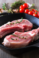 Raw steaks in grill pan ready to cook