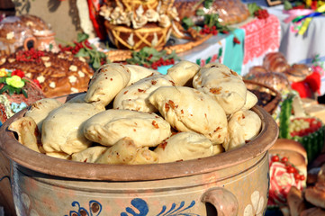 traditional ukrainian food - dumplings (varenik) and various ukrainian food in festive decorating on background