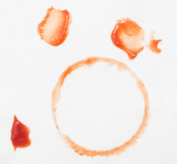 stains from ketchup on white material