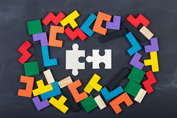 Business creative solution concept jigsaw on the blackboard
