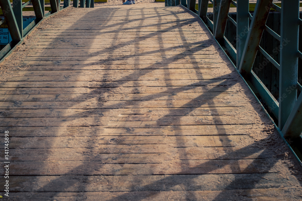 Wall mural wooden walkway to beach
