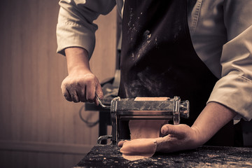 The chef makes fresh spaghetti from scratch.