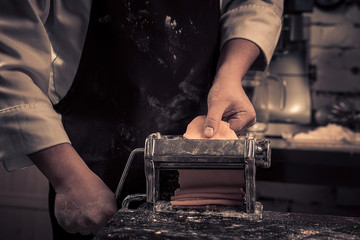The chef makes fresh spaghetti from scratch.