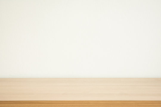 wooden table white wall background