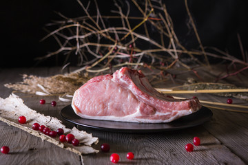 Fresh game meat on a wooden table