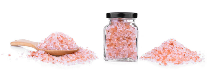 Pink Himalayan salt on a wooden spoon isolated on white background.