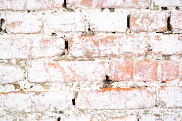 Ancient old brick white wall with moss. Brick Texture of old wall