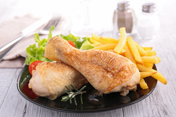 grilled chicken leg and french fries
