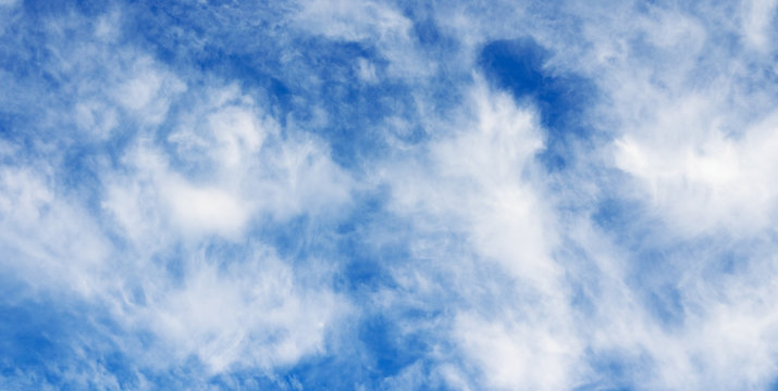 Cloudy sky background. White clouds and blue sky.