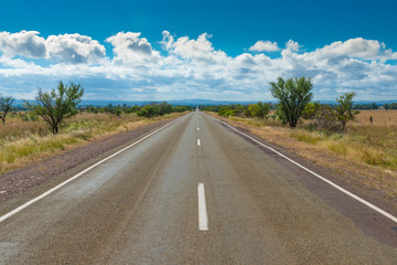 Fototapeta na wymiar Empty Australian highway two lane road in rural outback