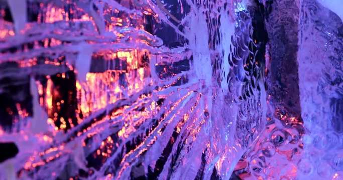 Close up of ice sculpture as the sunset shines through the ice