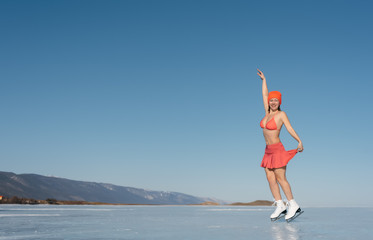 Girl extreme sports in a swimsuit on ice skating.