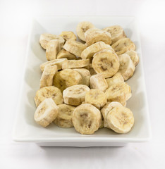 Pieces of banana in white plate