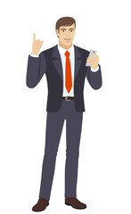 Businessman with mobile phone pointing up