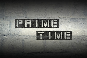 prime time stencil print on the grunge white brick wall