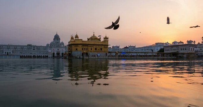 The Golden Temple at Amritsar, Punjab, India, the most sacred icon and worship place of Sikh religion. Time lapse fading from sunset to dusk.