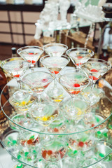 Cold alcoholic margareta cocktail. Glass with drink stands on the glass stand