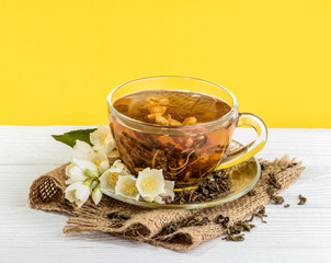 Cup of jasmine tea with flowers