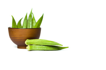 Okra in a bowl isolated over white background