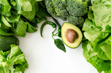 Avocado, salad, broccoli, spinach and pepper on white background. Healthy food concept with fresh...