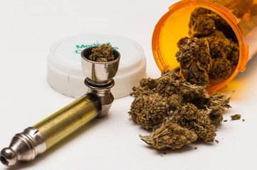 Pipe and container of spilled medical marijuana