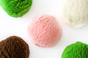 Variety of ice cream scoops, isolated on white background. Copyspace.
