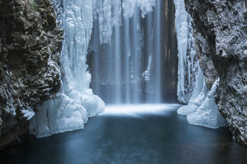 Italy, trentino south Tyrol, Non Valley, Waterfall from Smeraldo lake in winter.