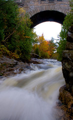 River Flowing Under Historic Arched Stone Bridge Acadia National Park