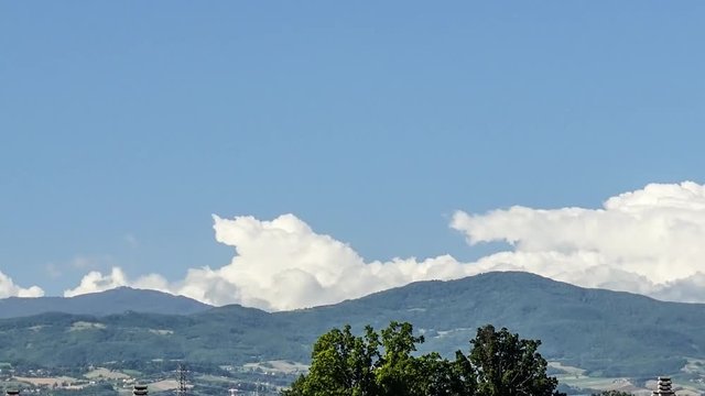 4K Time-lapse Zoom Clouds roll over the Apennines Italy