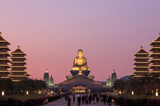 Kaohsiung, Taiwan. Sunset at Fo Guang Shan buddist temple of Kaohsiung with many tourists walking by.