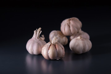 Garlic. Fresh Garlic. Cloves of garlic on black background.