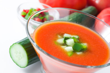 Traditional Spanish cold gazpacho soup and ingredients  isolated on white background
