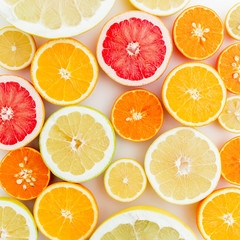 Lemon, orange, grapefruit, sweetie and pomelo on white background. Flat lay, top view. Food pattern