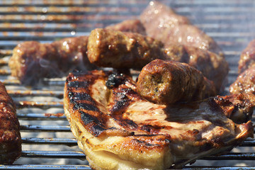 Grilled pork steak on the grill