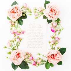 Floral frame with pink rose, leaves, buds and paper card with calligraphy isolated on white background. Flat lay, top view. Frame background