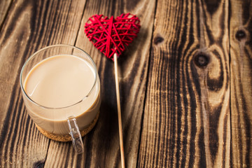 cup of coffee with milk and handmade heart