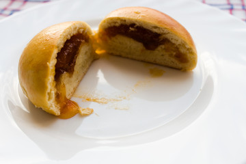 baked little bun with jam