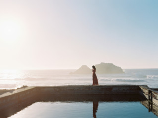 Woman standing on pool edge