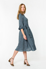 Young elegant female in light summer dress, over white background