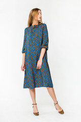 Young elegant female in light summer dress, over white background