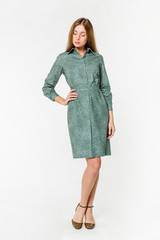 Young elegant female in light summer dress, over white background