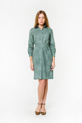 Young elegant female in light summer dress, over white background